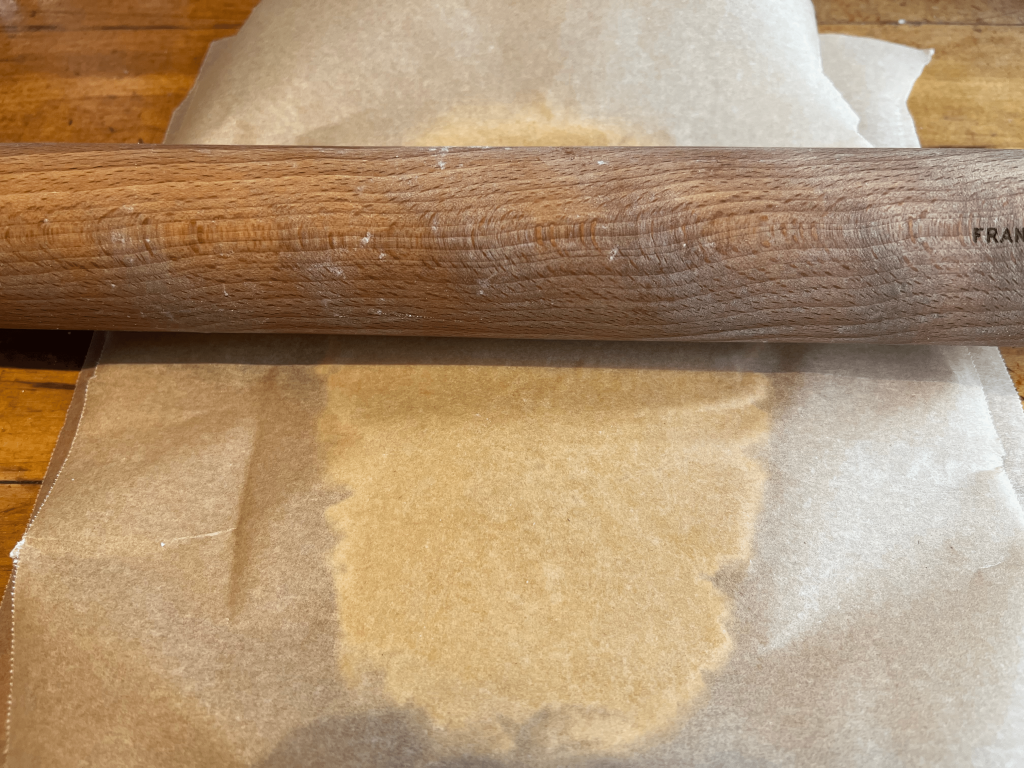 Rolling out pastry for Christmas mince pies using local ingredients