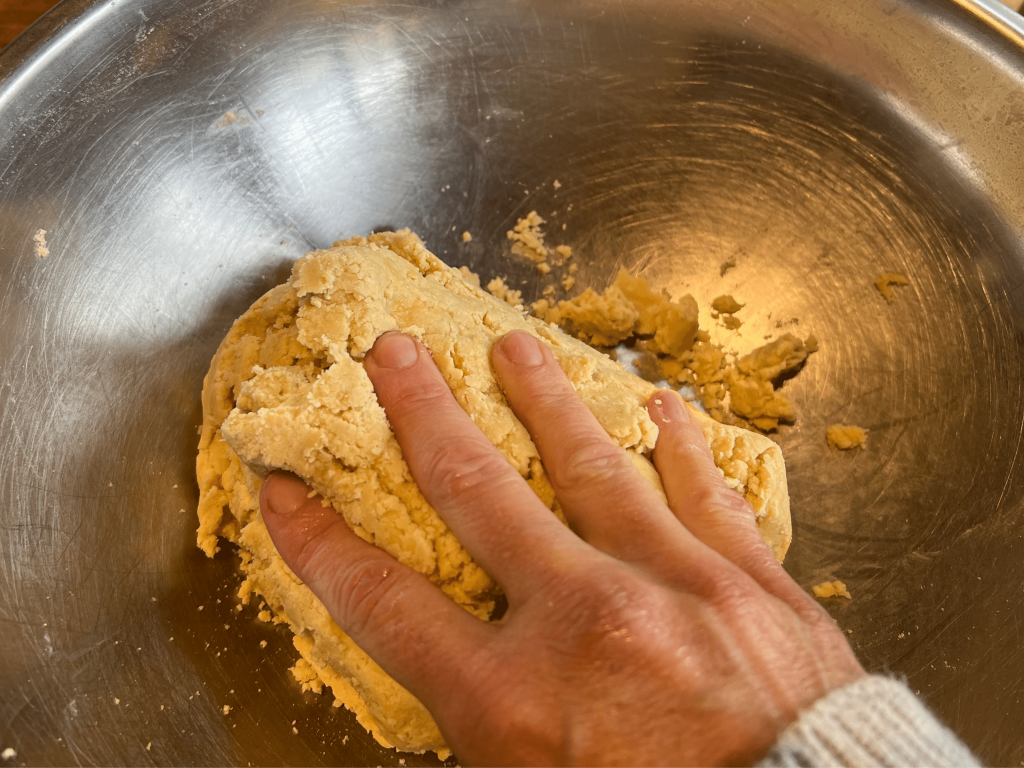 Form pastry dough into a ball by hand for sweet pastry